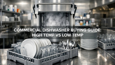 Commercial kitchen dishwashing station with stainless steel dishwasher and racks of dishes