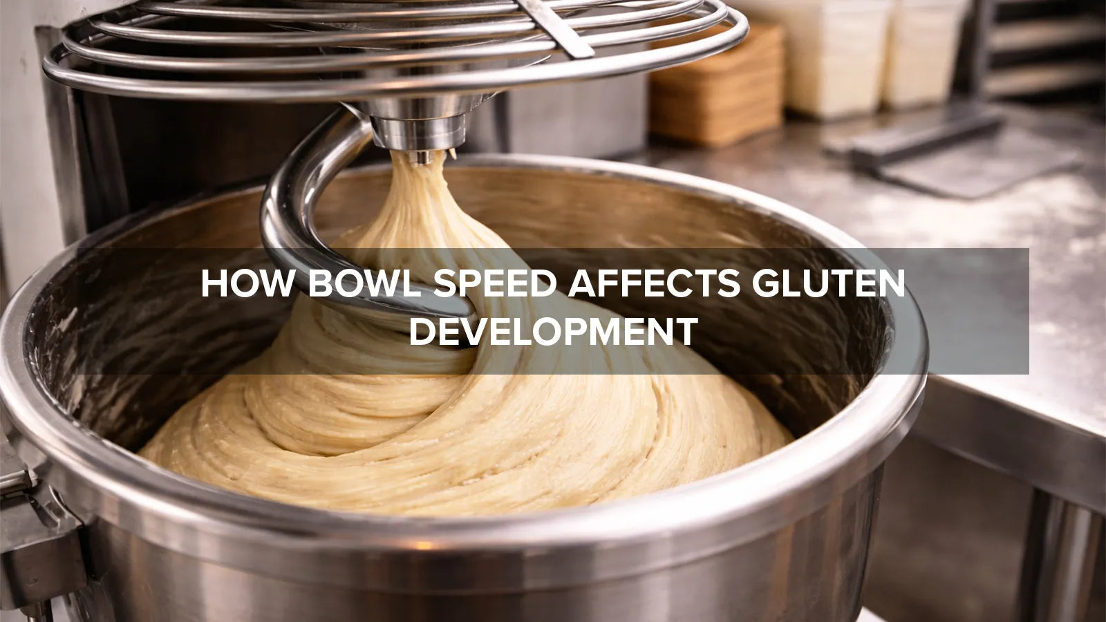 Spiral mixer bowl rotating while kneading dough, demonstrating how bowl speed affects gluten development