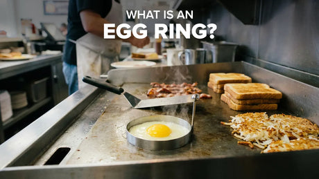 Egg ring on a flat-top griddle shaping an egg into a perfect circle for breakfast sandwiches