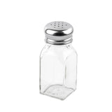 A clear glass salt shaker with a square base and rounded shoulders. This classic piece from the salt & pepper shakers set features a shiny stainless steel top with multiple holes and is set against a plain white background.