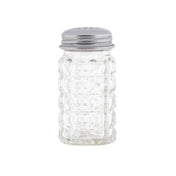 A clear, empty glass salt shaker with a grid pattern sits upright. Part of the Nostalgia Collection salt & pepper shakers, it features a silver metal screw-on lid with holes. The image has a plain white background.