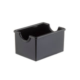 A black, rectangular plastic Sugar Packet Rack with smooth sides and two semi-circular cutouts on opposite top edges for easy access. This glossy, dishwasher safe box from TableCraft Products appears empty, set against a plain white background.