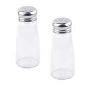 Two empty, clear glass Salt & Pepper Shakers with stainless steel tops stand upright on a white background. The shakers are identical in size and shape, perfect for seasoning your meals.