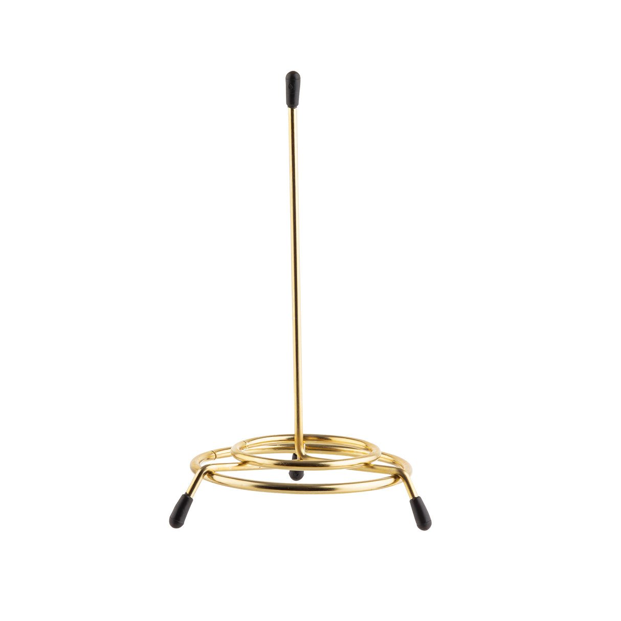 A brass plated paper towel holder with a central upright rod and circular base by TableCraft Products. The minimal, modern design features three outer feet with black rubber tips for stability, similar to a check spindle.