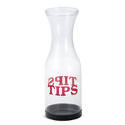 A clear, empty Tip Carafe with a black base sits upright. The word TIPS is printed in bold red letters on the front and mirrored above it for double-sided readability. Made in USA and dishwasher safe for easy cleaning.
