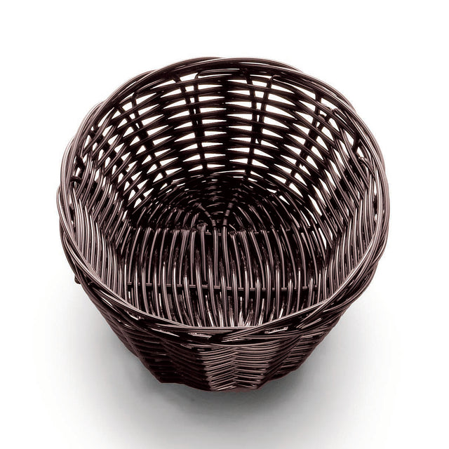 A round, empty, dark brown hand-woven basket sits on a white surface. The tightly woven pattern of polypropylene cord features visible vertical and horizontal strands, creating an open, airy texture. The view from above shows the circular shape inside.
