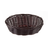 A round, empty, dark brown hand-woven Basket with a woven pattern and slightly flared rim, photographed on a white background. The basket’s texture and natural material are clearly visible.