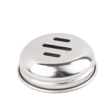 A round, shiny stainless steel object with a slightly domed top and three horizontal slots. This replacement shaker top features a raised rim at the base and is photographed on a plain white background.