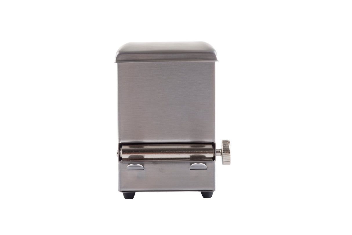 A stainless steel toothpick dispenser viewed from the front against a white background; it has a rectangular shape, a rounded top, a small knob on the right side, and two small black feet at the bottom.