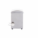 A stainless steel toothpick dispenser, viewed from the side. It has a square shape, two protruding levers, and a large round knob on the left side. The top is slightly curved, and it rests on four small black feet against a white background.