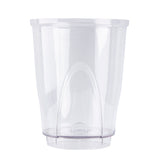 A clear, empty plastic cup with smooth sides and a slightly flared rim sits upright on a flat base. This dishwasher safe cup features a raised, curved design at the bottom center for a modern, minimalist look. Plain white background.