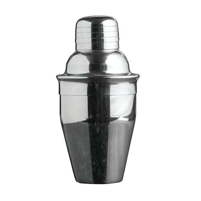 A shiny, stainless steel cocktail shaker is shown against a plain white background. The shaker has a rounded cap and tapered body, with a reflective surface that emphasizes its smooth, polished appearance.