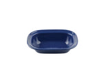 A dark blue enamel rectangular pan with rounded corners and a glossy finish. The serving pan features a smooth surface with tiny white speckles and slightly raised edges, sitting empty and isolated on a plain white background.