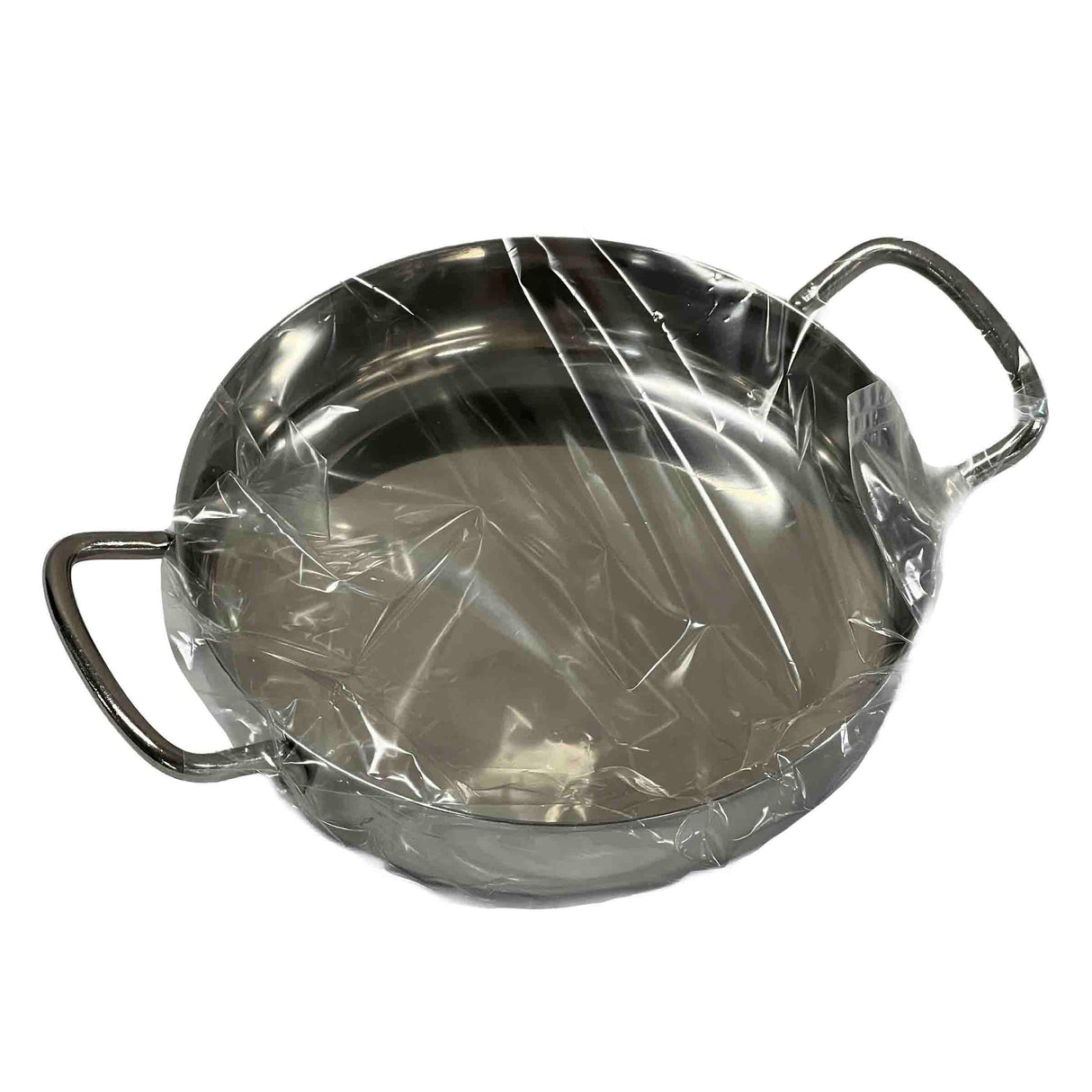 A round, stainless steel Mini Brazier with two handles is covered in clear, slightly wrinkled plastic wrap. The induction safe pan sits empty against a white background, its top tightly sealed.