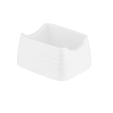 A small, white, rectangular Pulito Collection sugar packet holder with slightly rounded edges and a grooved texture. Featuring half-moon cutouts for easy access, its smooth, glossy ceramic surface is empty and photographed on a white background.