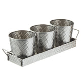 Three small, silver, diamond-patterned metal pots from the Lattice Collection Snack Set are arranged in a matching rectangular tray with handles. This shiny, stainless steel snack set by TableCraft Products is perfect for stylish organization or decoration.