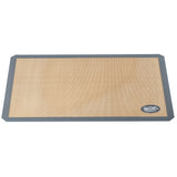 A full size, rectangular, tan-colored silicone baking mat with a dark gray border and the TableCraft logo in white on one corner. The mat lies flat and is designed for nonstick baking or food prep.