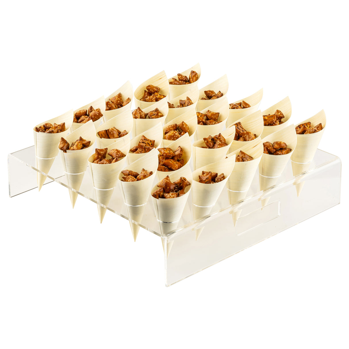 A clear TableCraft cone holder displays 24 small, cream-colored paper cones filled with chopped brown treats, possibly caramelized nuts or granola. The cones are neatly arranged in rows, pointed downward into holes in the acrylic stand.