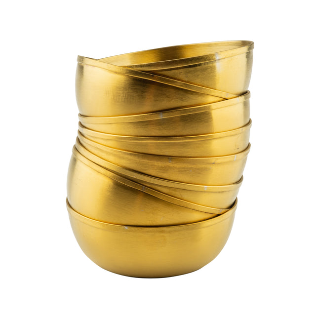 A stack of five shiny, round, gold brushed serving bowls is shown. The bowls are neatly nested, each one slightly tilted so their edges create overlapping spirals. The plain white background highlights their metallic stainless steel gloss.