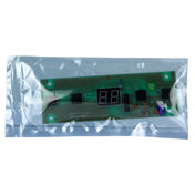 A small green electronic circuit board with a two-digit LED display, designed for Empura Ice Machines (E-UCF120), and black components, sealed inside a clear anti-static plastic bag, photographed on a white background.
