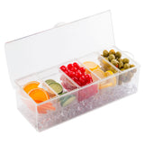 A clear polystyrene condiment holder with five compartments displays orange slices, lime slices, cherries, lemon slices, and green olives on a layer of clear ice cubes. The lid is open, showcasing this classic TableCraft Products bar condiment holder against a white background.