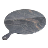 Round, flat serving paddle with a handle, made of dark, marbled wood featuring swirling grain patterns in shades of gray and brown. The handle has a hole at the end for hanging. The board is placed on a white background.
