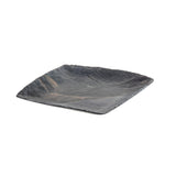 A square, dark-colored melamine plate with irregular, wavy textured lines and slightly upturned edges. Its glossy finish features shades of dark gray and subtle blue highlights. The plate resembles a modern serving tray on a white background.