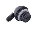 A close-up of a black and gray polypropylene Replacement Lid with a flip-top, photographed on a white background. The cap, compatible with TableCraft bottles, features a circular seal and a small opening for pouring or drinking.