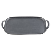 A rectangular cast iron griddle with a flat, textured cooking surface and slightly raised edges, featuring a handle on each side. Inspired by TableCraft tray designs, it’s black and suitable for stovetop or oven use.