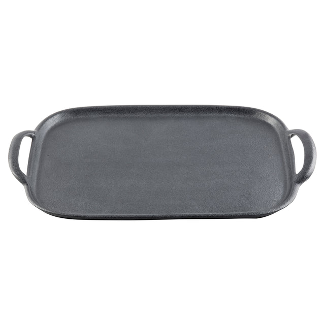 A rectangular cast iron griddle with a flat, textured cooking surface and slightly raised edges, featuring a handle on each side. Inspired by TableCraft tray designs, it’s black and suitable for stovetop or oven use.