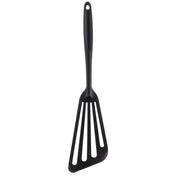 A black Fish Turner with a stainless steel core and a long silicone handle. The triangular, slightly angled head has three wide slots, perfect for flipping or serving food. A small hole at the end of the handle allows easy hanging.