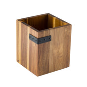 A square acacia cutlery holder with a natural wood grain finish, open at the top. Part of the industrial collection, it features a black metal accent with rivets near the upper edge and sits on a white background.