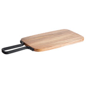 A rectangular acacia serving paddle with rounded corners and a black metal handle, shown on a white background. The wood grain is visible, and the handle—attached with two screws on each side—adds an industrial touch to this TableCraft serving paddle.