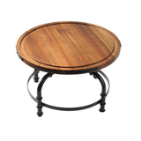 Round wooden table with a smooth, light brown top featuring visible wood grain. Supported by a black metal frame with four curved legs and circular supports, this industrial cake stand is photographed on a white background.