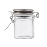 A small, empty clear glass spice jar with a resealable stainless steel clamp lid is shown against a plain white background. The cylindrical jar features smooth sides, a round base, and a secure hinged latch with wire clasp.