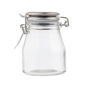 A small, empty clear glass spice jar with a wide mouth and a resealable stainless steel clamp lid. The lid features a metal hinge and latch mechanism, and the clean jar sits upright on a white background with no label or content inside.
