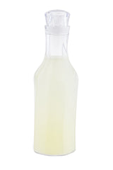 A clear glass carafe with a stopper, filled with a pale yellow liquid. The bottle has smooth, slightly curved sides and a narrow neck. The background is plain white, making the 1-1/2 qt carafe and its contents clearly visible.
