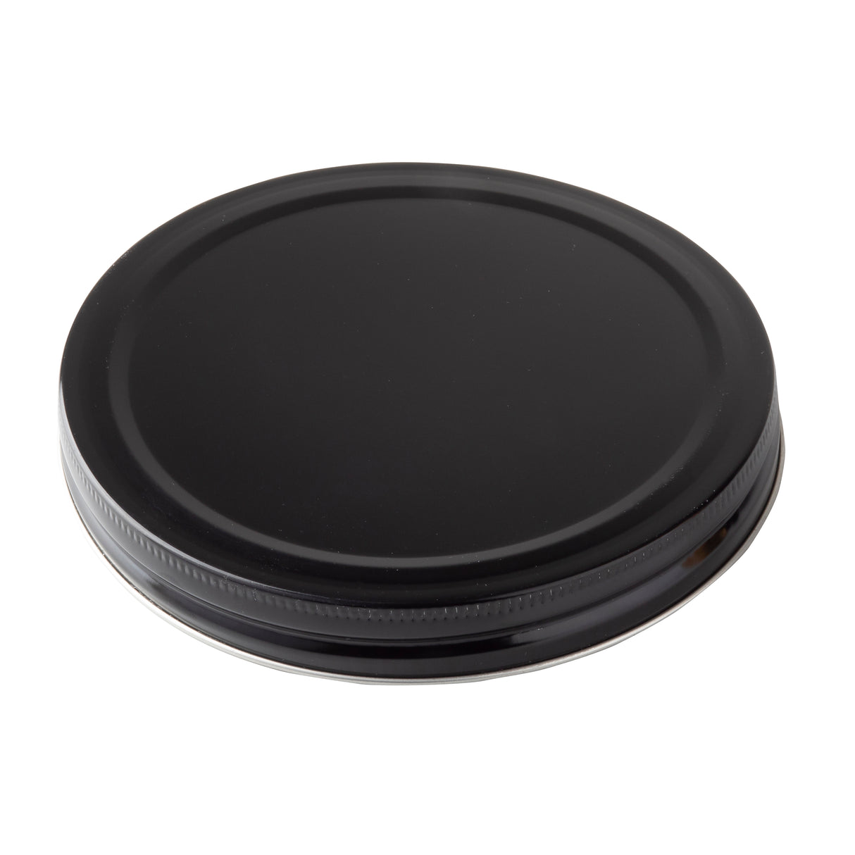 A black, round, metal replacement lid with a smooth top surface and ribbed edges, viewed from an angle against a white background. Suitable for sealing jars or as a TableCraft beverage dispenser lid, it appears unused and clean.