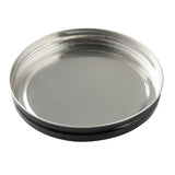 A round, shallow, metallic tin replacement lid with a shiny silver surface, ridged edges, and a black outer rim—designed for a TableCraft beverage dispenser—lies flat with the inner side facing up on a plain white background.