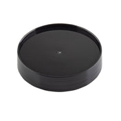 A black, round, plastic Replacement Cap with a slightly raised edge and glossy finish, photographed on a white background. This TableCraft pour lid is plain and smooth, featuring a small circular indentation in the center.