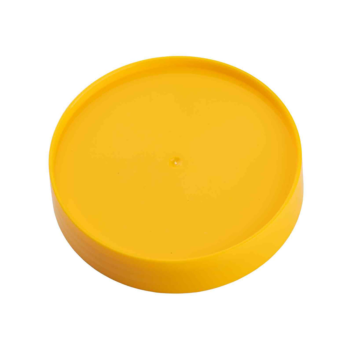 A bright yellow, flat, circular plastic lid from the PourMaster series is shown against a white background. The surface is smooth, with a small dot in the center—ideal as a dishwasher safe replacement cap with a slightly raised edge.