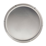 A round, silver stainless steel tray viewed from above. The tray features a smooth, shiny surface and a raised rim with evenly spaced, thin ridges adding texture and decoration. The center of this TableCraft tray is plain and unadorned.