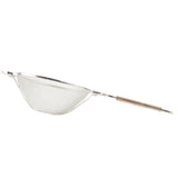 A metal mesh strainer with a double medium mesh wire basket and a long, flat wooden handle. The strainer is photographed against a white background and is designed for sifting or draining foods.