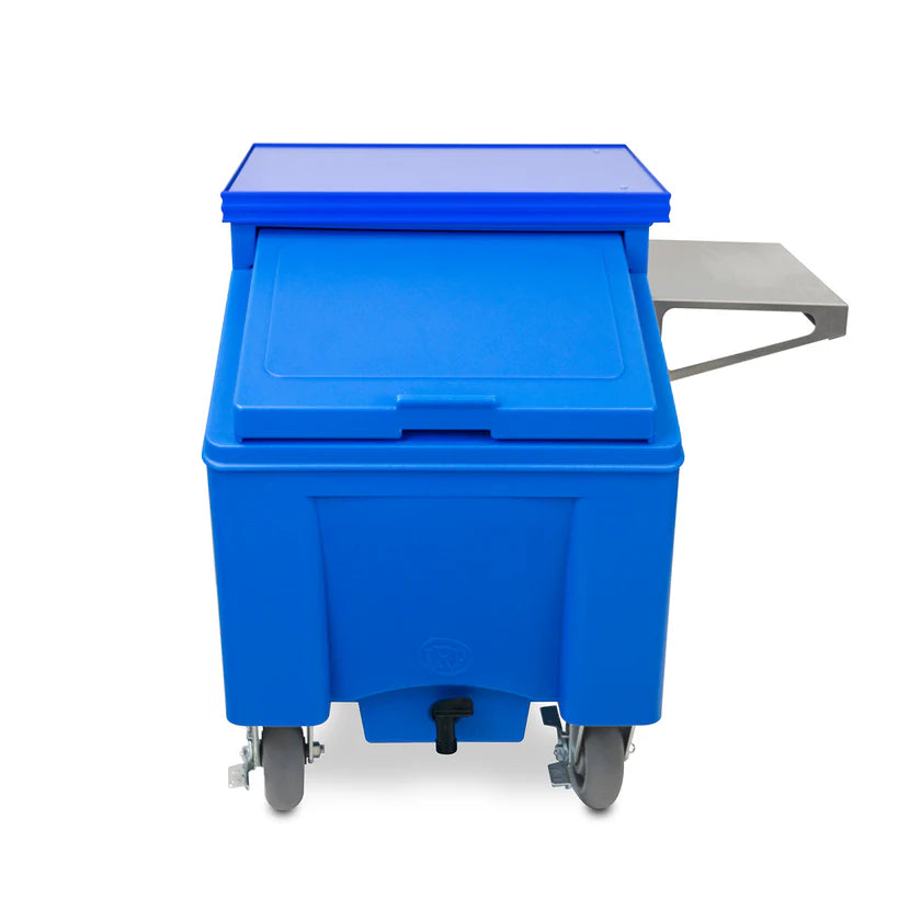 A blue plastic mobile ice chest with a closed rectangular lid, four wheels, a spout at the bottom, and a metal shelf attachment on the right side. The cart is photographed against a plain white background.