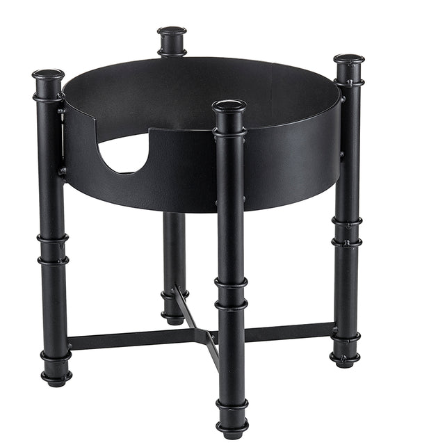 A black metal fire pit log holder with four cylindrical legs resembling bamboo and crossbars for support, inspired by the TableCraft Industrial Collection. The modern, sturdy design doubles as a beverage dispenser base for outdoor gatherings.