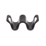 A black, curved melamine object with a wavy shape, featuring two oval openings on each side and a raised center, photographed on a white background—ideal for holding tacos like the Taco Taxi by TableCraft.