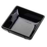 A small, glossy black square bowl with slightly angled sides and rounded corners, viewed from above at a slight angle. This mini melamine bowl is empty and set against a white background.