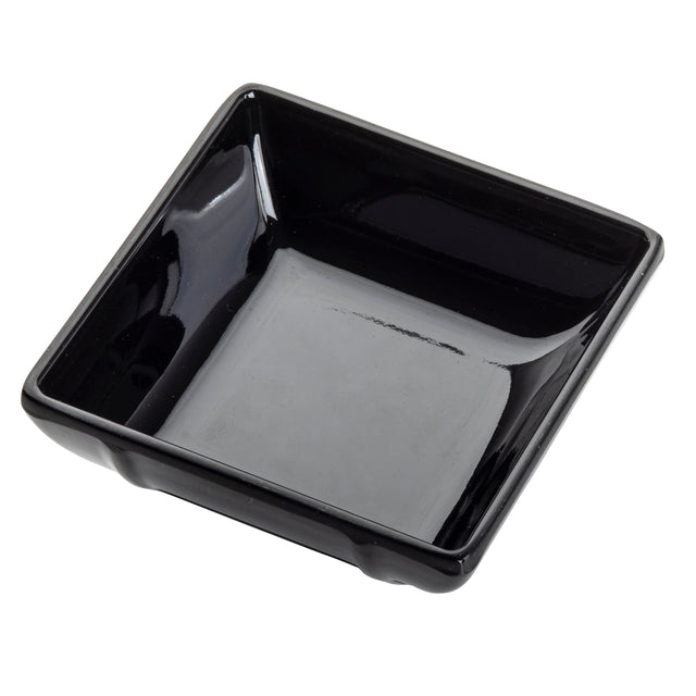 A small, glossy black square bowl with slightly angled sides and rounded corners, viewed from above at a slight angle. This mini melamine bowl is empty and set against a white background.