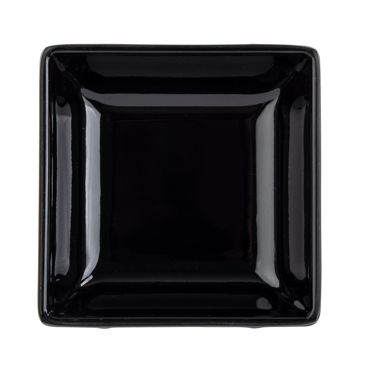 A glossy, black square bowl is photographed from above against a white background. The bowl has slightly raised edges and a minimalist design, reflecting light at the corners and sides, emphasizing its smooth and polished surface. Dishwasher safe bowl.