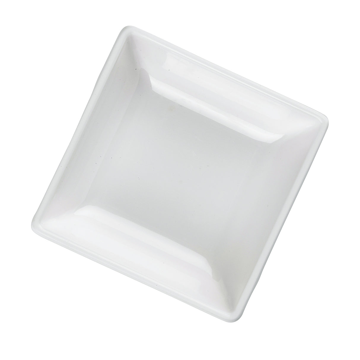A square, shallow white ceramic dish, reminiscent of a mini melamine bowl, is shown at a slight angle on a plain background. Its smooth, glossy surfaces and gently rounded edges give it a clean and minimalist appearance. Dishwasher safe for easy care.